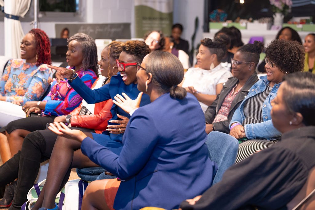 Women sharing lived experience at a shiftHER event